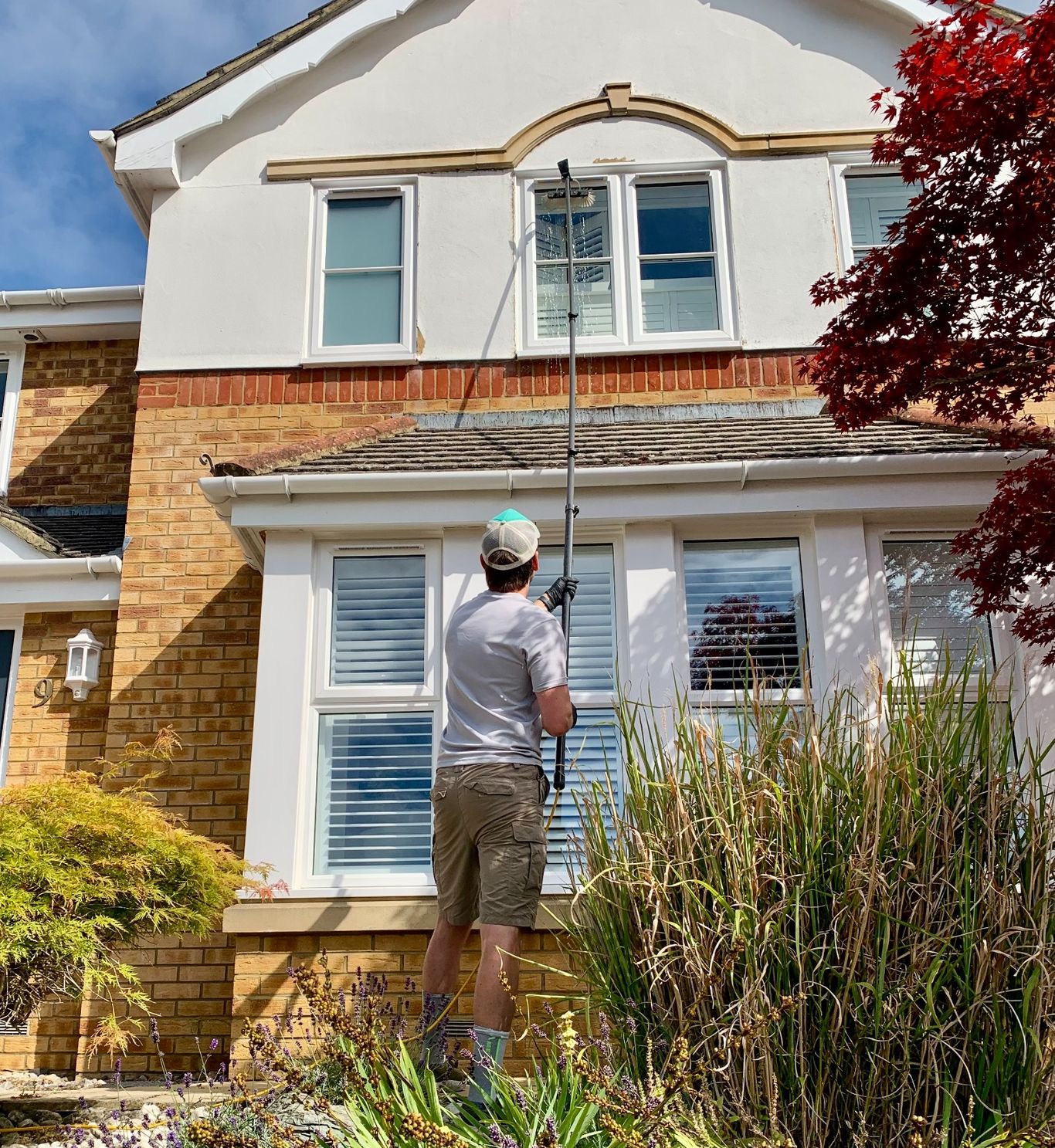 Residential window cleaning using water-fed pole in Virginia Water