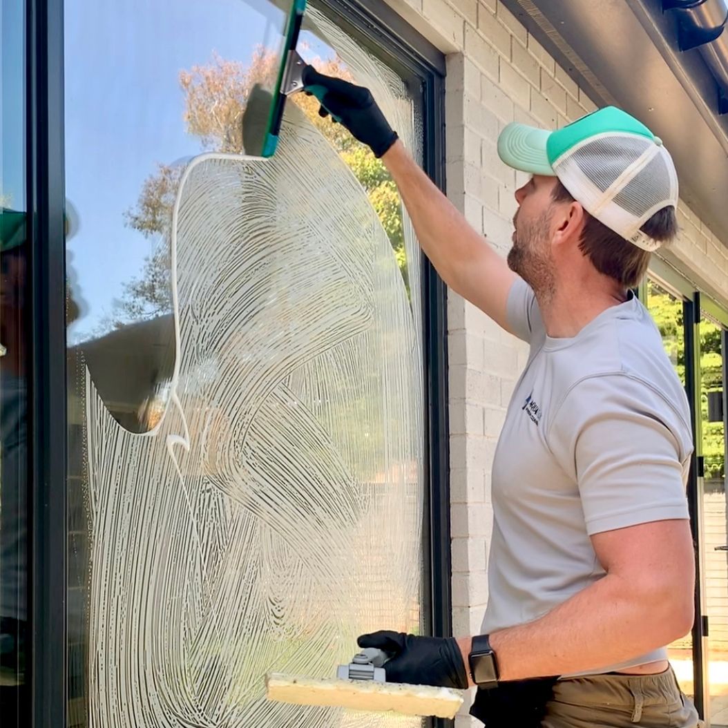 Aquatek team providing residential window cleaning in Englefield Green